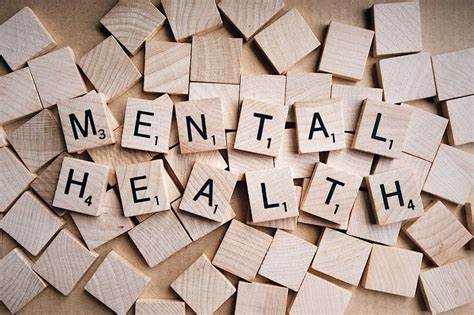 Mental Health logo featuring the words "Mental Health" written on wooden blocks